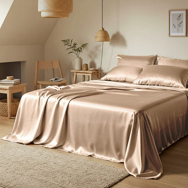 Bedroom with satin sheets and pillows in a cozy room setting.