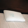 White pillow with text on a bed